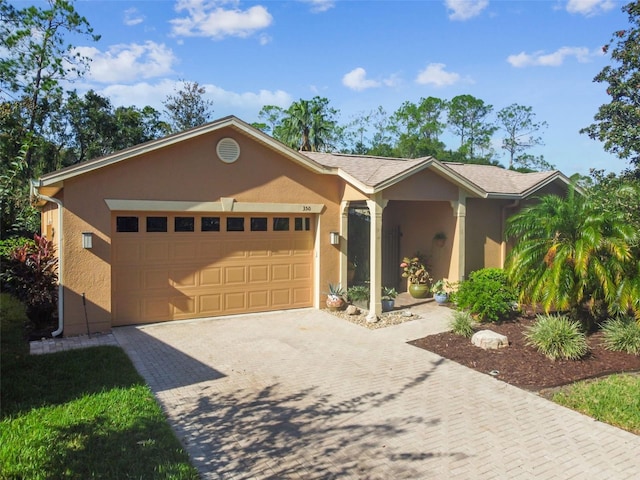 ranch-style house featuring a garage