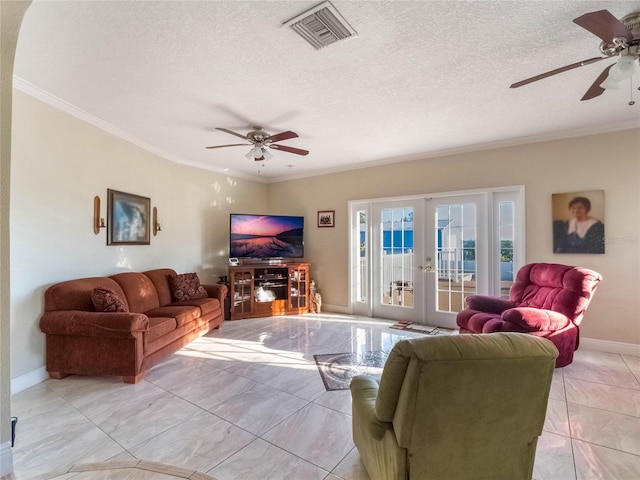 living room with french doors, a textured ceiling, crown molding, and ceiling fan