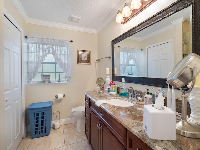 bathroom featuring toilet, crown molding, and vanity