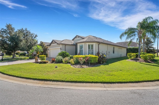 single story home with a garage and a front lawn