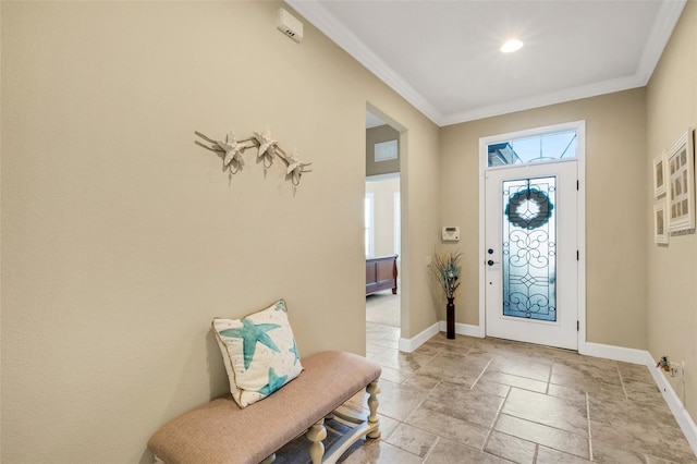 entrance foyer featuring crown molding