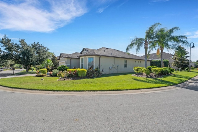 view of side of home featuring a lawn