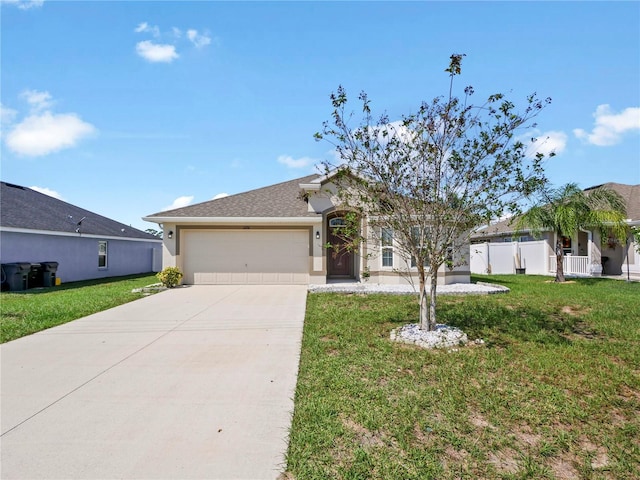 ranch-style home with a front lawn and a garage