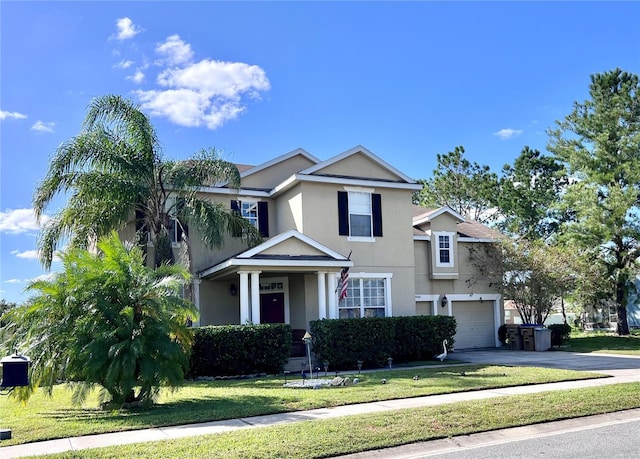 3040 Palermo Rose Way, Kissimmee, FL 34746 - traditional home with stucco siding, driveway, a garage, a front yard, and a porch