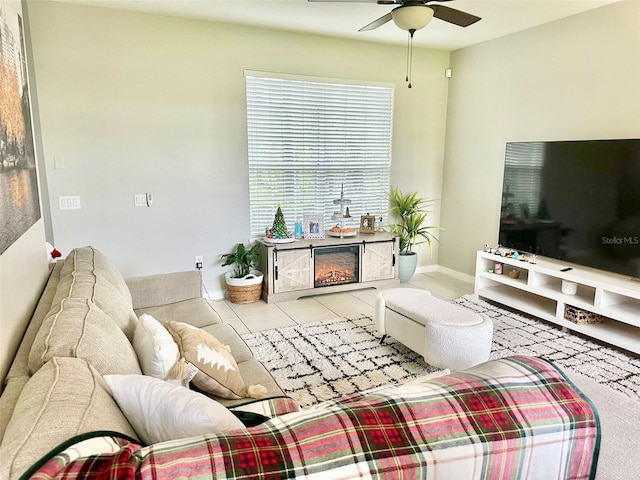 living room featuring ceiling fan and light tile patterned flooring