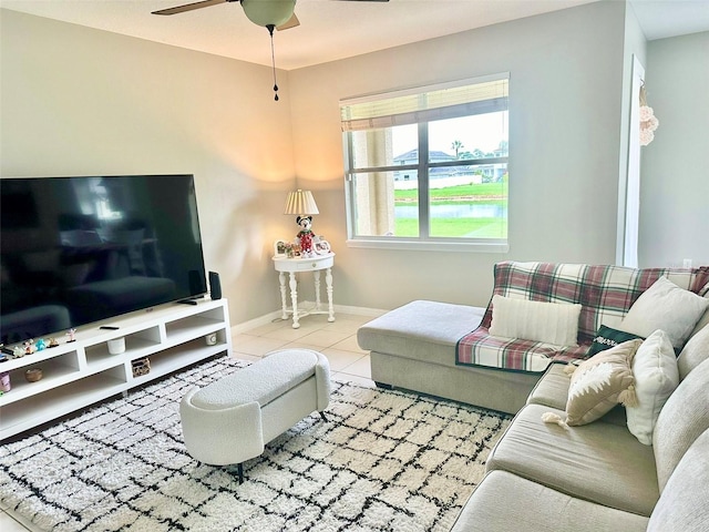 living room with ceiling fan and tile patterned flooring