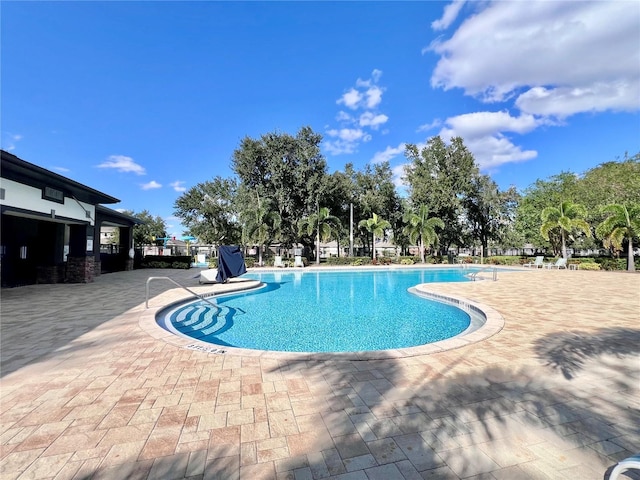 3040 Palermo Rose Way, Kissimmee, FL 34746 - community pool with a patio