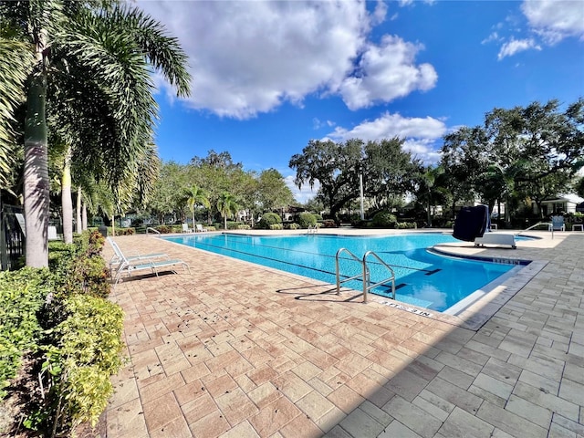 view of pool featuring a patio area