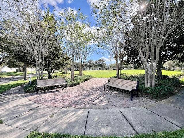 view of property's community featuring a patio and a yard