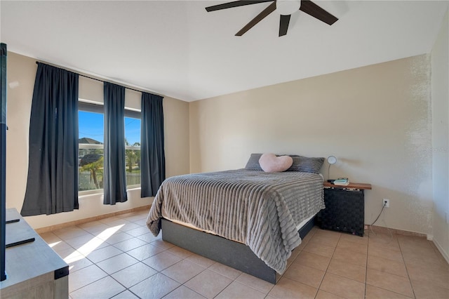 bedroom with light tile patterned flooring and ceiling fan