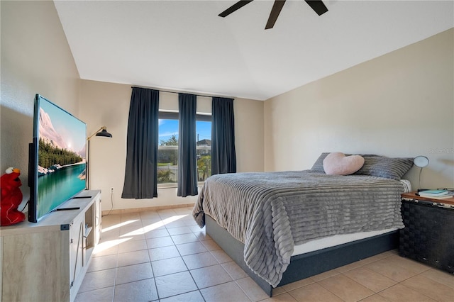 tiled bedroom featuring ceiling fan