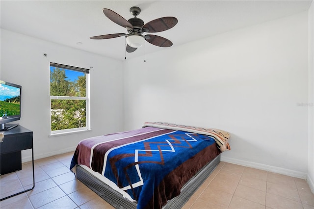 bedroom featuring light tile patterned floors and ceiling fan