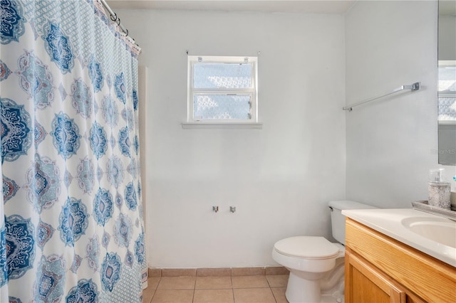 bathroom featuring vanity, toilet, tile patterned floors, and a shower with shower curtain