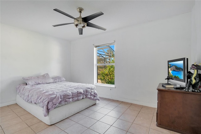 tiled bedroom with ceiling fan