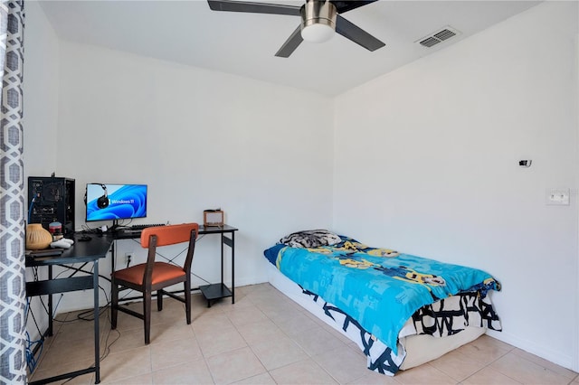 tiled bedroom featuring ceiling fan