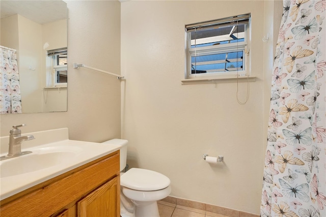 bathroom featuring vanity, toilet, curtained shower, and tile patterned flooring