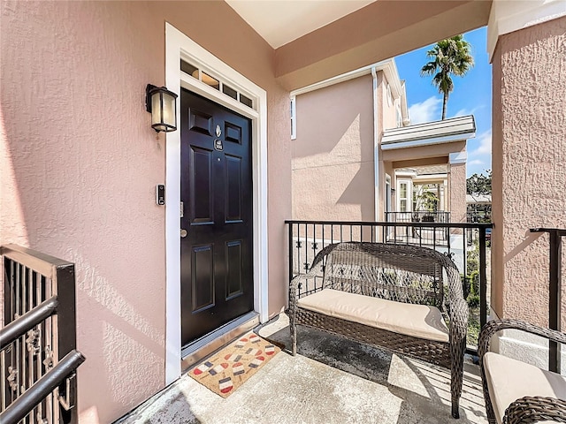 entrance to property with a balcony