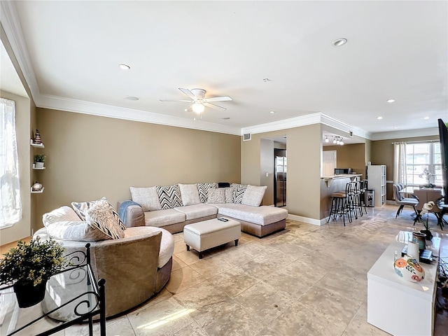 living room with ceiling fan and crown molding