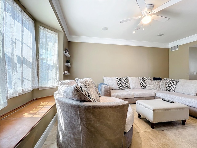 living room with crown molding, light tile patterned floors, and ceiling fan