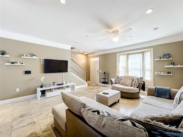 living room with ceiling fan and crown molding