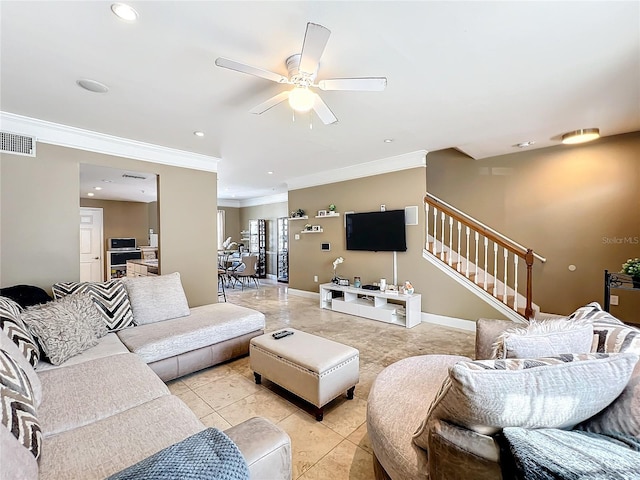 tiled living room with ceiling fan and ornamental molding