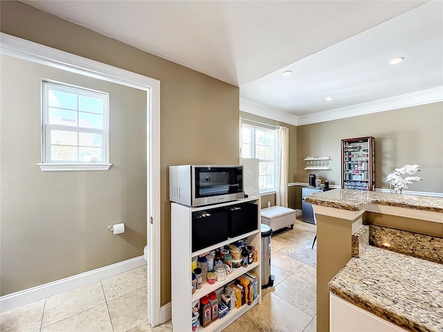 tiled living room featuring ornamental molding