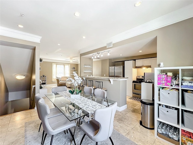 tiled dining space with crown molding