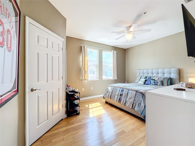 bedroom with ceiling fan and light wood-type flooring