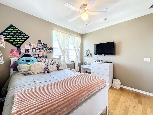 bedroom featuring light hardwood / wood-style floors and ceiling fan