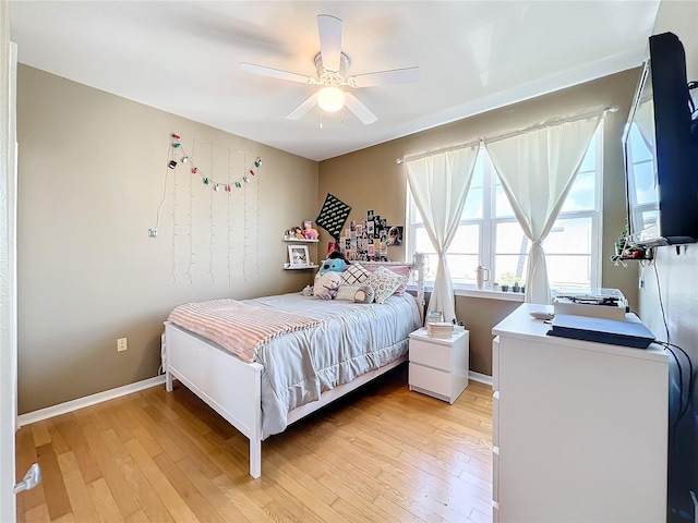 bedroom featuring light wood-type flooring and ceiling fan