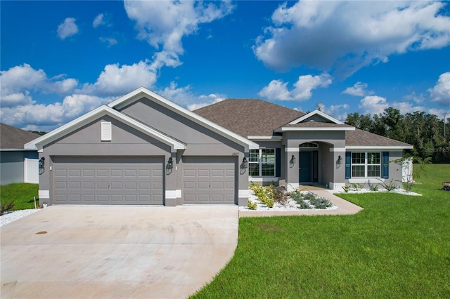 view of front of property featuring a garage and a front lawn