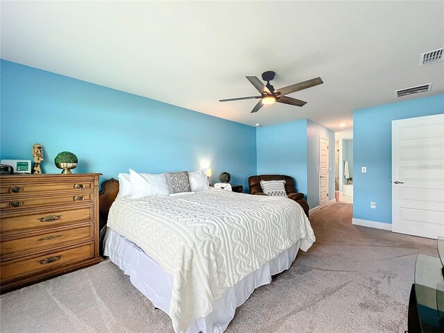 bedroom featuring a closet, ceiling fan, and light colored carpet