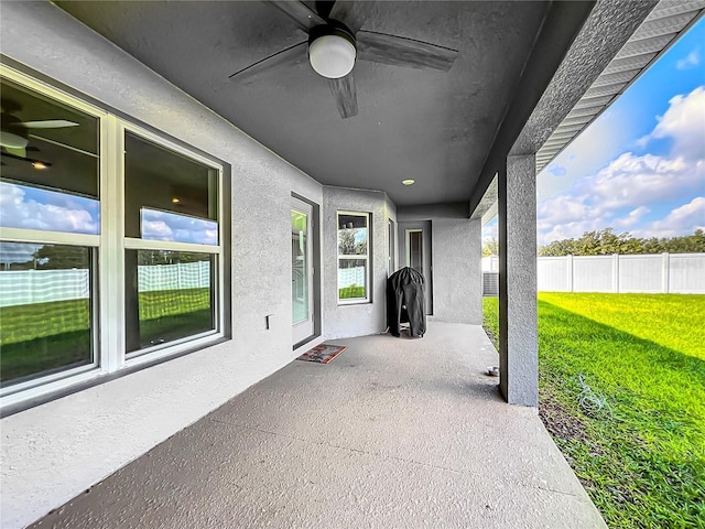 view of patio featuring ceiling fan