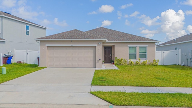 view of front facade with a front lawn and a garage