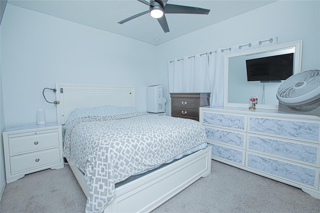 bedroom with light colored carpet and ceiling fan