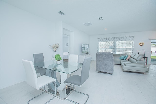 dining room with light tile patterned flooring