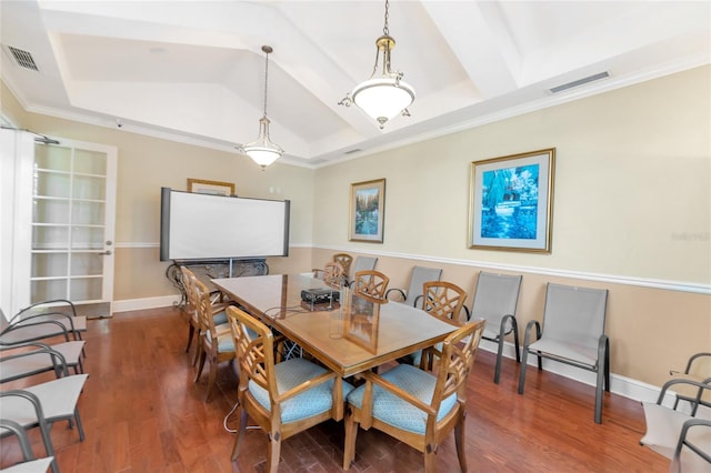 dining space featuring a raised ceiling, beam ceiling, ornamental molding, and dark hardwood / wood-style floors