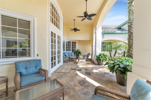 view of patio with french doors, ceiling fan, and outdoor lounge area