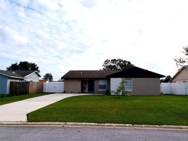 ranch-style house with a front yard