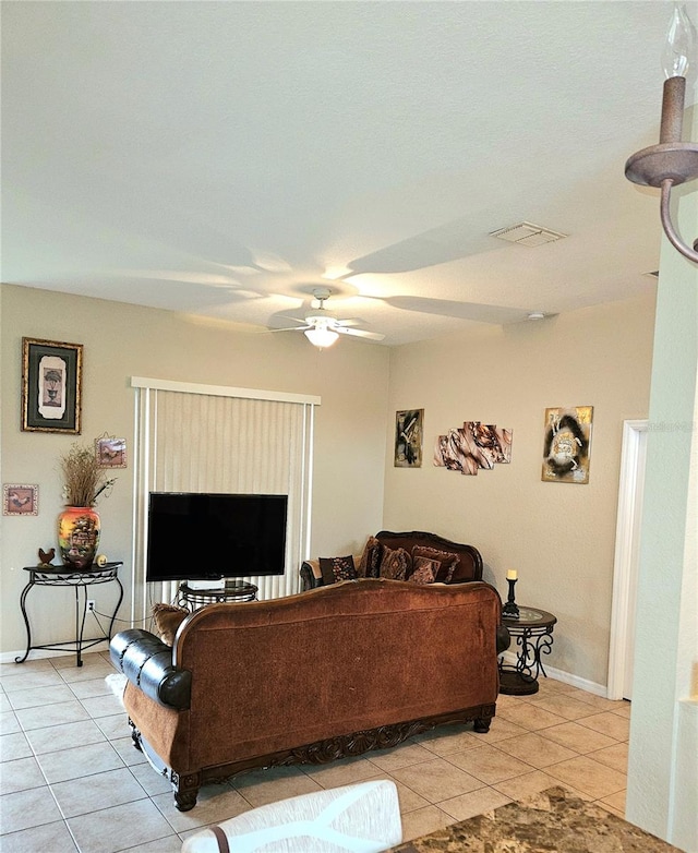 living room with light tile patterned flooring and ceiling fan