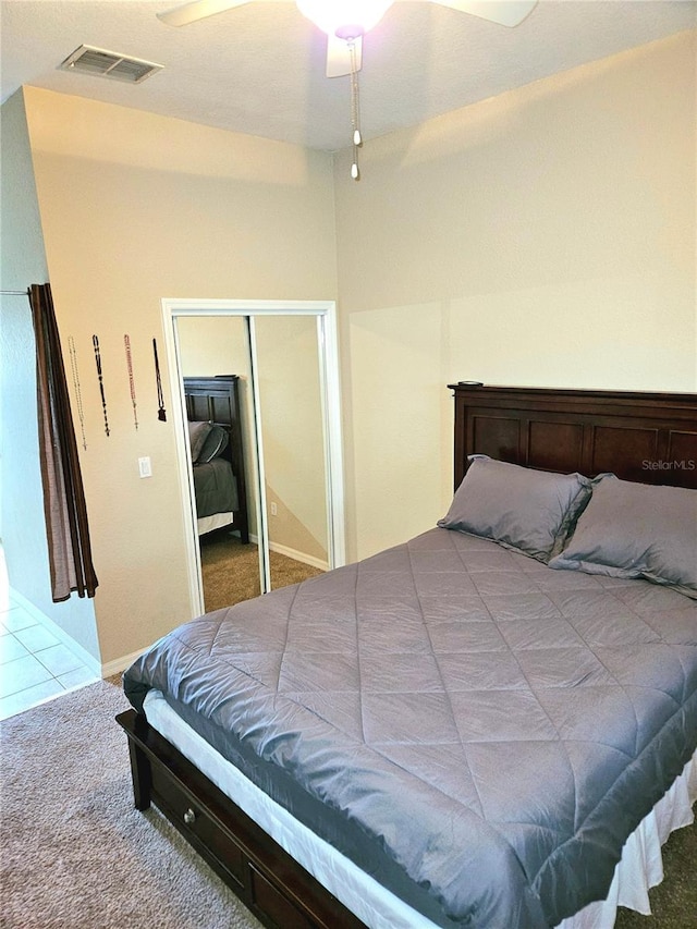 bedroom featuring a closet, carpet floors, and ceiling fan