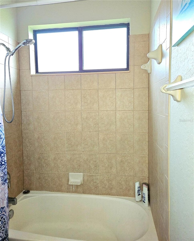 bathroom featuring shower / bath combination with curtain