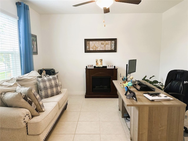 office space featuring ceiling fan and light tile patterned flooring