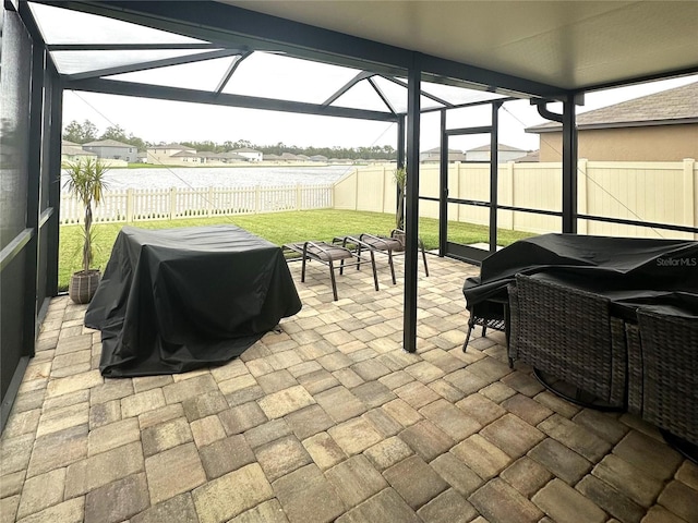 view of patio / terrace with glass enclosure and grilling area