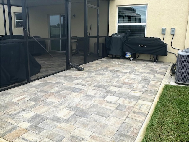 view of patio with area for grilling and cooling unit