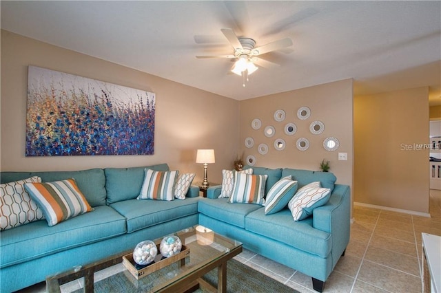 living room with tile patterned flooring and ceiling fan