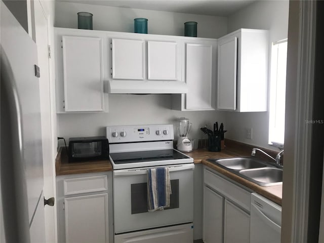 kitchen featuring refrigerator, white electric range oven, a sink, under cabinet range hood, and dishwashing machine