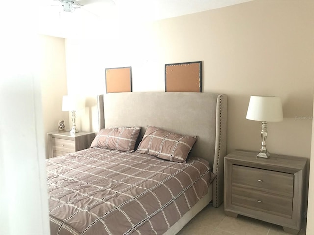 tiled bedroom with ceiling fan