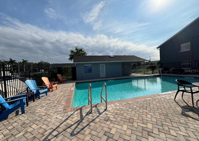 view of swimming pool with a patio