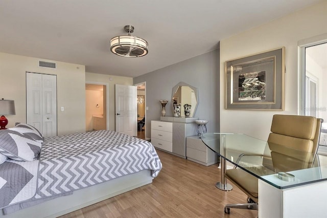 bedroom with a closet and wood-type flooring